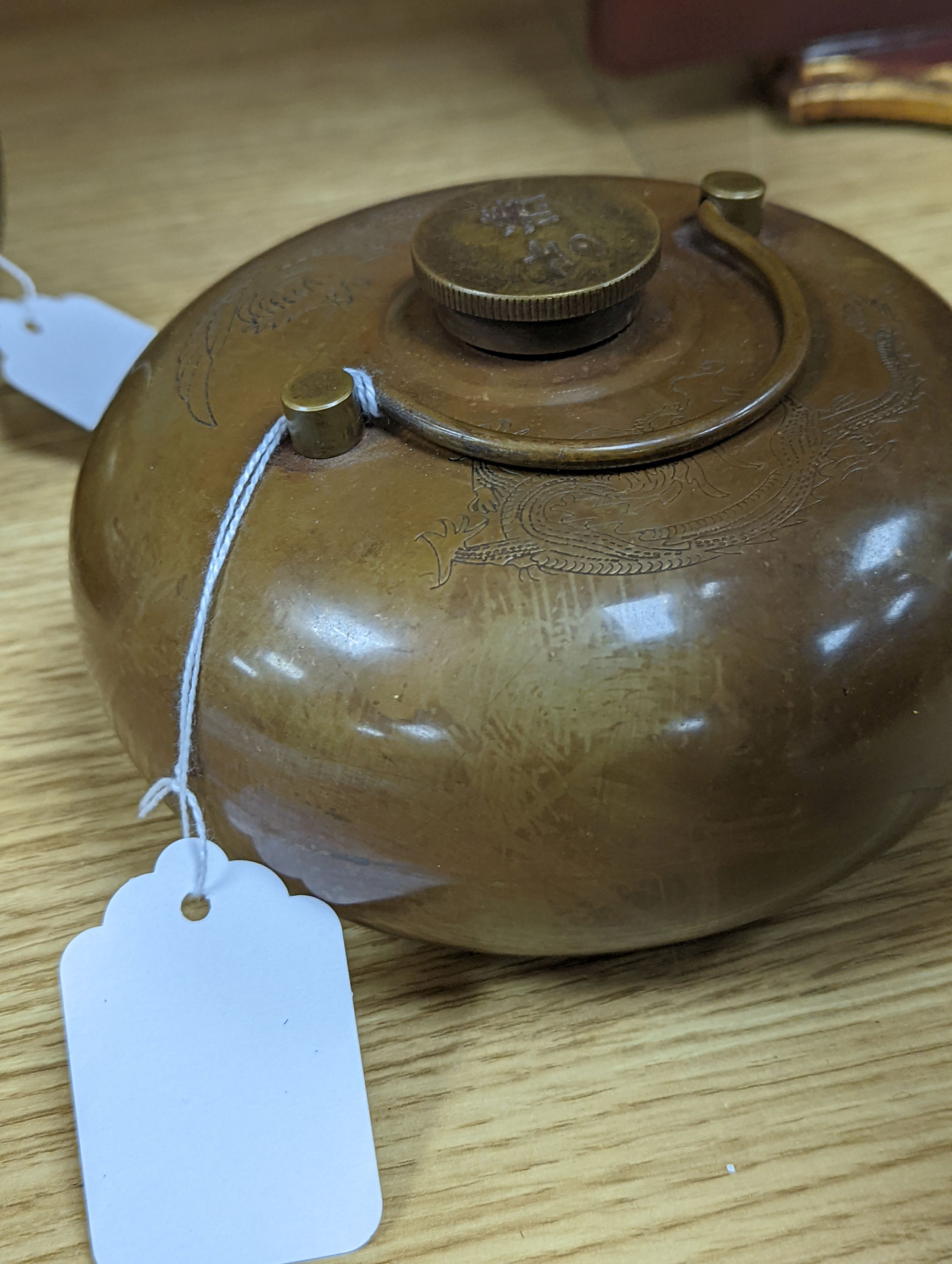 Two Chinese bronze handwarmers and a turquoise glazed jar